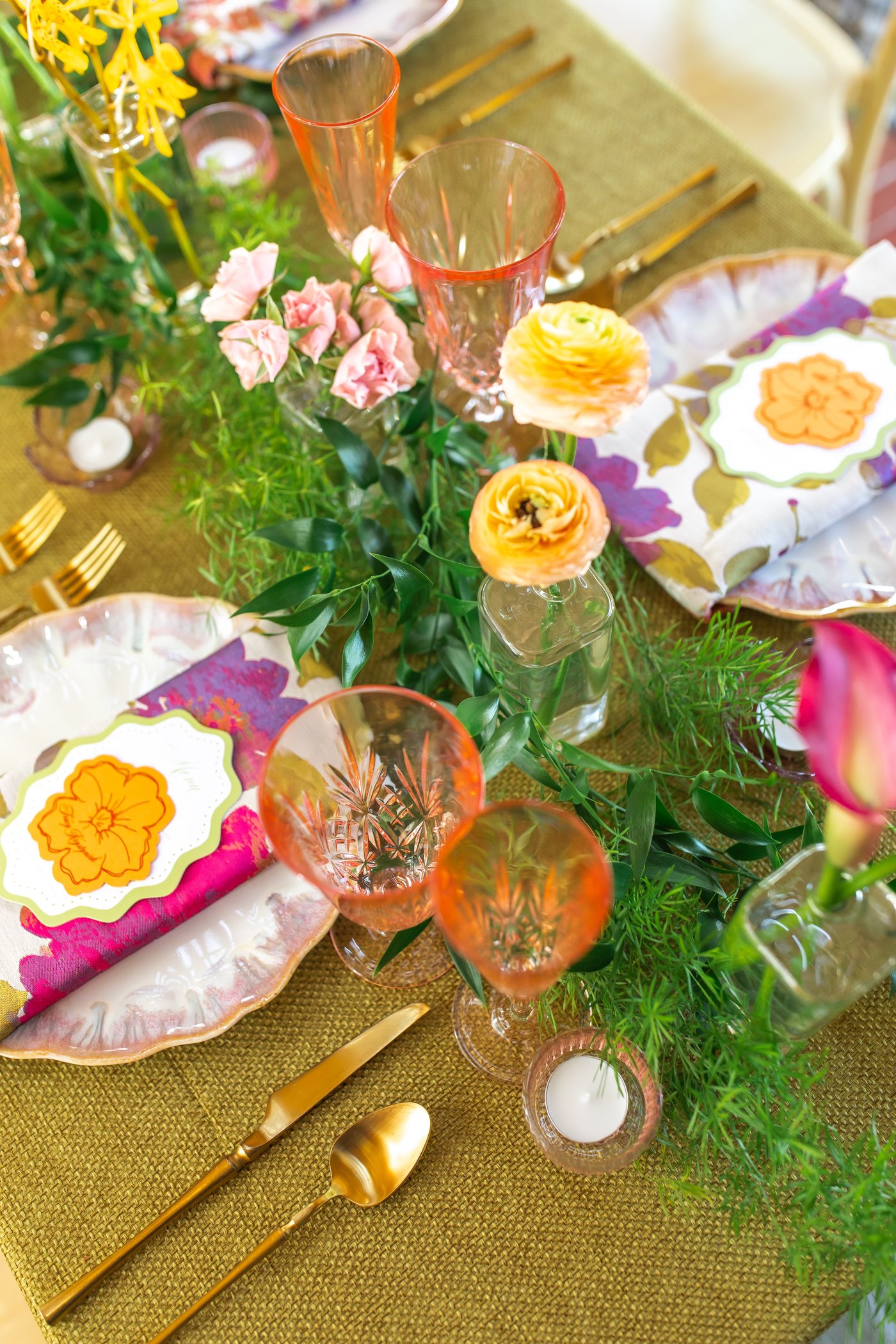 Garden party tablescape detail with pink glassware and ranunculus, styled by Chloe & Co. Signature Events