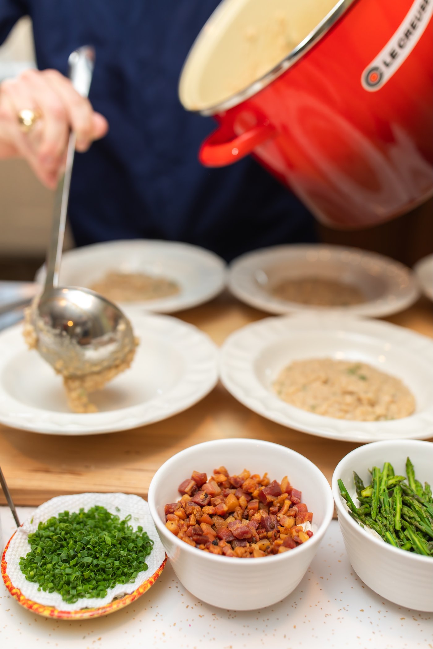 A private event chef plating a dish for a Chloe & Co. Signature Events private dinner party